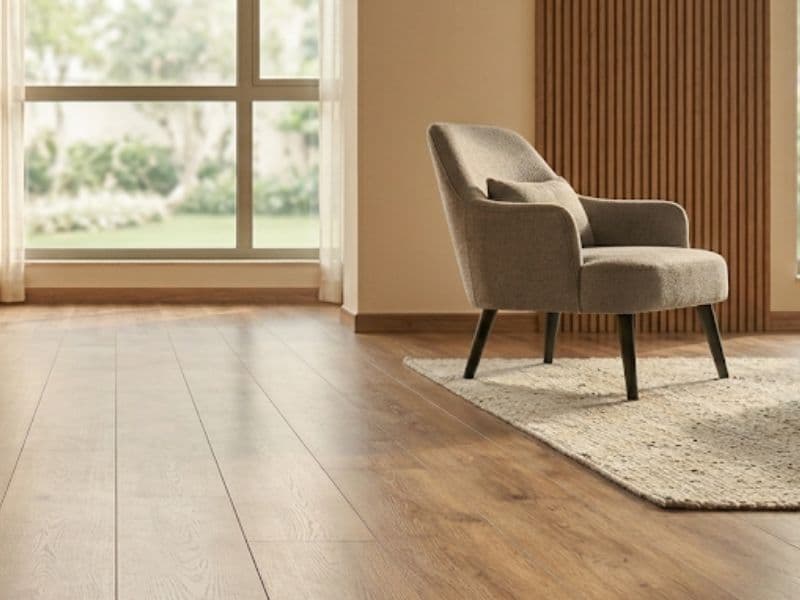 Engineered wood flooring in a Noida apartment living room by Inner Space Creation
